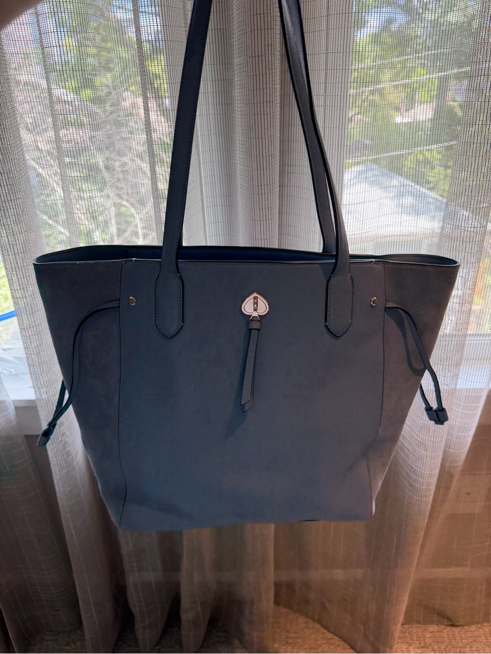 kate spade navy blue tote with tassel charm